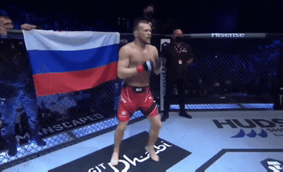 Fighter Holding Russian Flag In Cage GIF