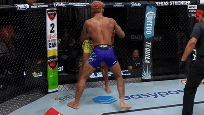 Fighter In Purple Shorts In Front Of Shots In Every Can Sign GIF
