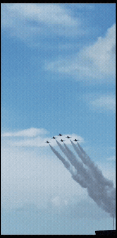 Fighter Jet Flying Behind Pilot In Helmet GIF