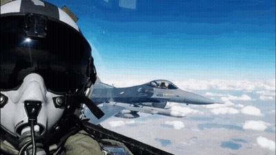 Fighter Jet Flying Behind Pilot In Helmet GIF