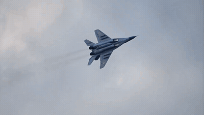 Fighter Jet Flying Through Clouds GIF