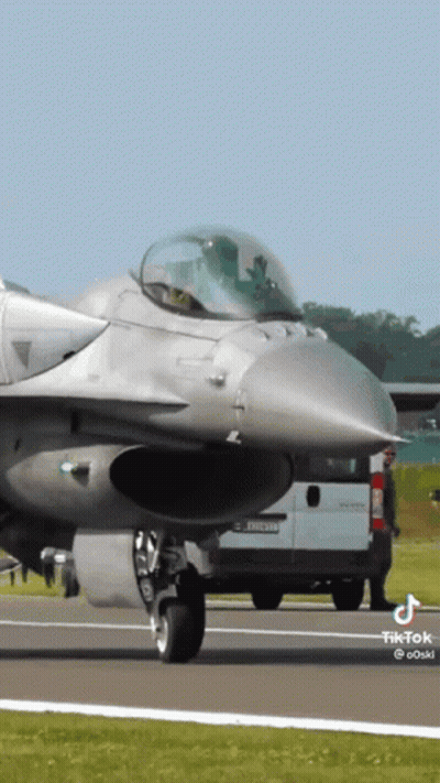 Fighter Jet Parked Next To Renault Van GIF