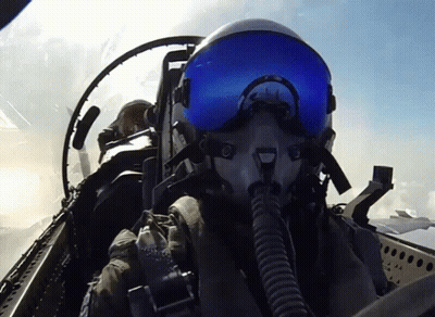 Fighter Jet Pilot In Helmet And Goggles Flying GIF