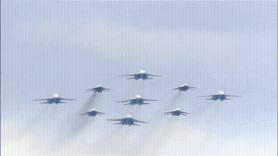 Fighter Jets Flying In Formation Against Blue Sky GIF