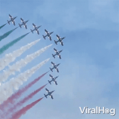 Fighter Jets Flying In Formation With Red White And Green Smoke GIF