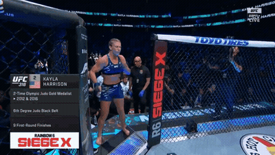 Fighter Kayla Harrison Standing In Ring GIF
