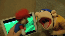 Fighting Puppets Bang Head Against Wall GIF