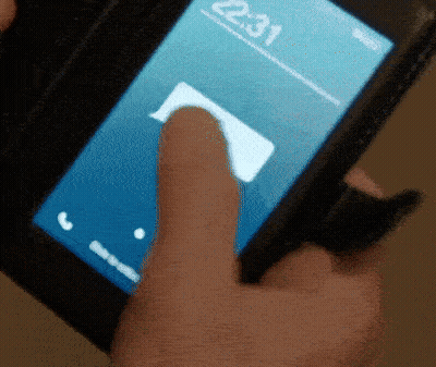 Finger Pointing At Cell Phone Screen Saying 22:31 GIF