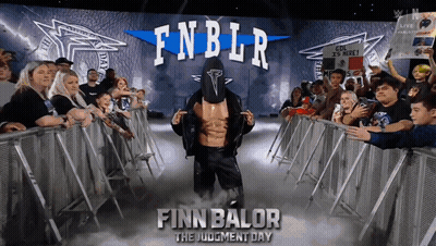 Finn Balor The Judgment Day Is A Wrestler That Is Standing In Front Of A Crowd GIF