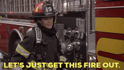 Firefighter In Front Of Fire Truck Saying Let's Just Get This Fire Out GIF
