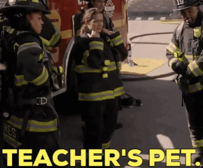 Firefighters Standing In Front Of Fire Truck Saying Teacher's Pet GIF