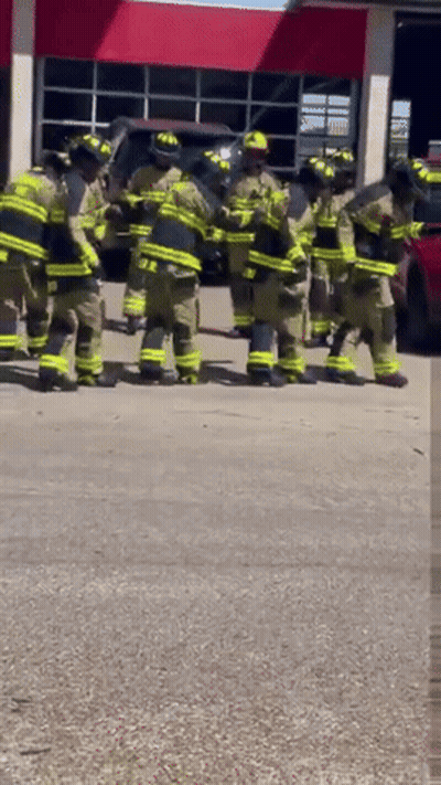 Firefighters Standing Outside Fire Station GIF