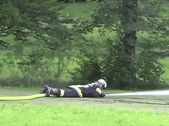 Fireman Demonstrate Fire Hose Power GIF