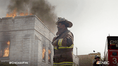 Fireman In Front Of Burning Building #ChicagoFire GIF
