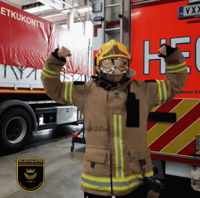 Fireman In Uniform In Front Of HEC Truck GIF