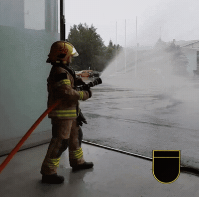Fireman In Yellow Helmet 510 Spraying Water GIF