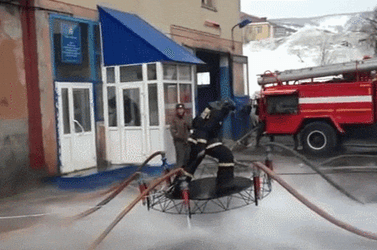 Fireman Levitate Using Fire Hose GIF