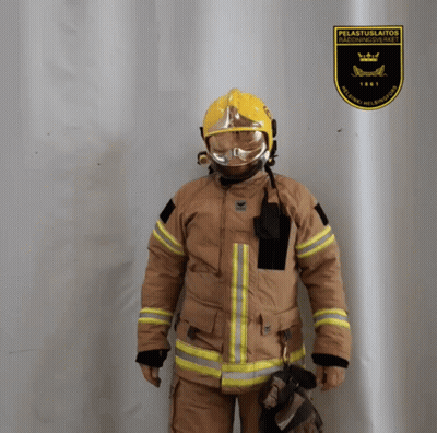 Fireman Standing In Front Of Pelastuslaitos Sign GIF