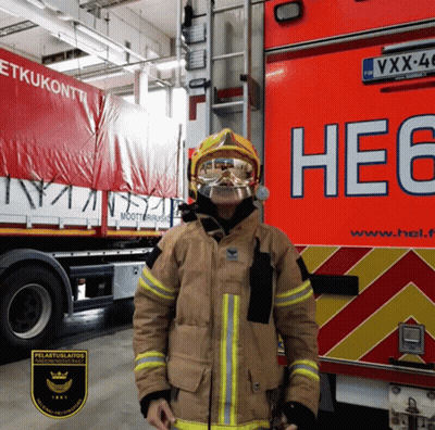 Fireman Standing In Front Of Truck Saying He6 GIF