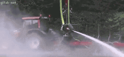 Fireman Swing Around Using Fire Hose GIF