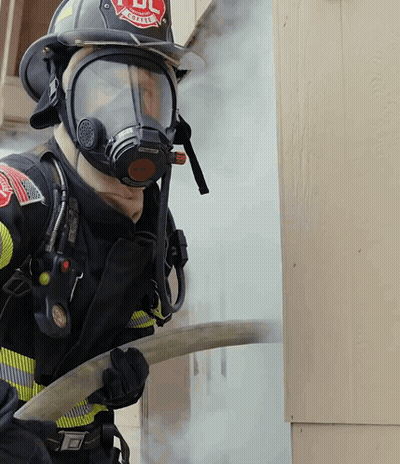 Fireman Wearing Mask And Helmet Saying UL GIF