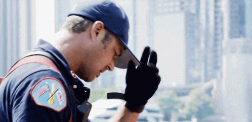 Fireman With Hat And Gloves And AA Patch GIF