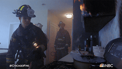 Fireman With Number 81 On Helmet In Kitchen GIF