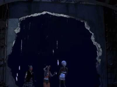 Fireworks Are Displayed Over A Sign That Says ' E.k. ' On It GIF