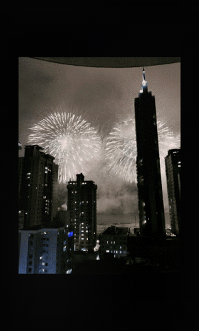 Fireworks Over City Skyline GIF