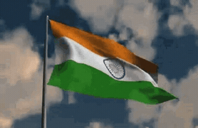 Flag Waving in Wind Against Cloudy Sky
