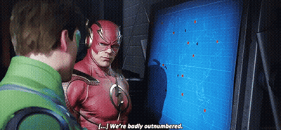Flash Costume Man Talking To Man In Green Jacket GIF