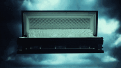 Flashing Light Coffin In Spotlight GIF