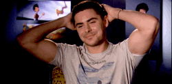 Flexing Zac Efron Satisfied GIF