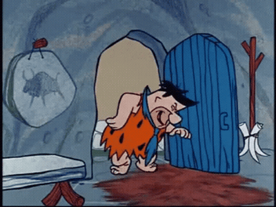 Flintstone By Blue Door With Letter G GIF