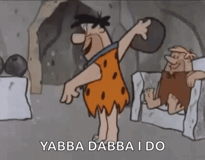 Flintstone Holding Rock Next To Chair GIF