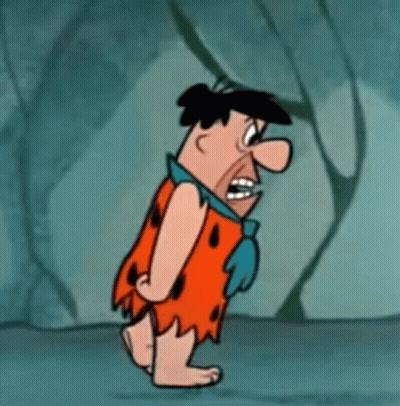 Flintstone Is A Cartoon Character From The Flintstones And Is Walking In A Cave . GIF