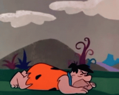 Flintstone Laying On Ground GIF