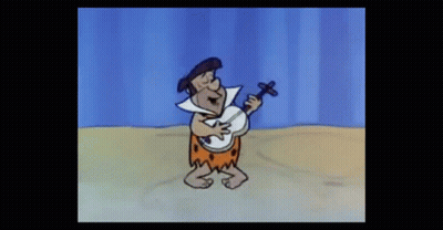 Flintstone Playing Banjo On Beach GIF
