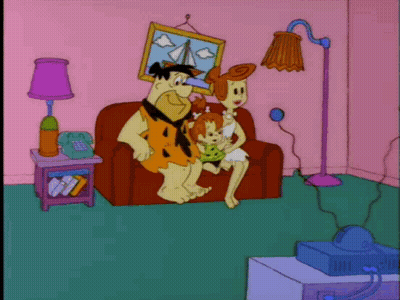 Flintstones Watching Television On Couch GIF