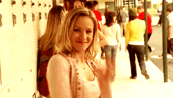 Flirty Woman Waving And Smiling GIF