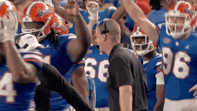 Florida Football Players Celebrating Win GIF