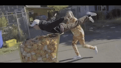 Flying Man And Woman Pushing Money Cart GIF