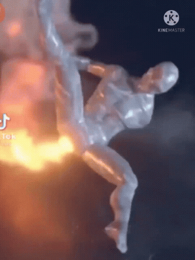 Flying Statue With Fire Behind GIF