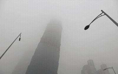 Foggy City With Very Tall Building GIF