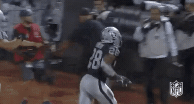 Football Game Crowd Woman Holding NFL Sign GIF