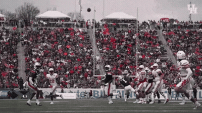 Football Game In Front Of Crowd With Texas Sign GIF