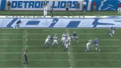 Football Game In Front Of Detroit Lions Banner GIF