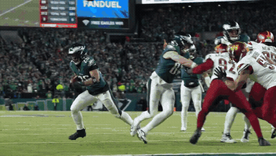 Football Game In Front Of FanDuel Scoreboard GIF