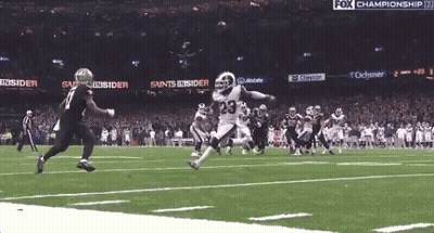 Football Game In Front Of Fox Championship Banner GIF
