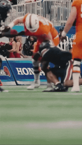 Football Game In Front Of Honda Banner GIF